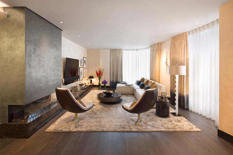 Luxury apartment living room with metallic bronze fireplace. 